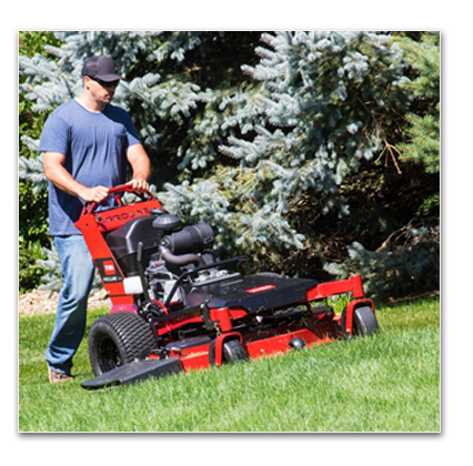 image of a man cutting lawn with a Proline